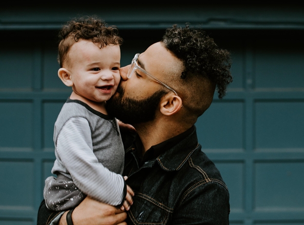 Father Holding His Son in His Arms